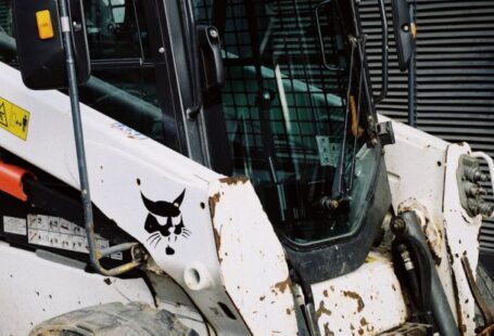 Automated Parking - Construction machinery waiting for installation of spare parts and overhauling on paving stones parking