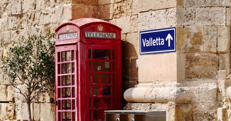 Greywater Recycling - A red telephone booth next to a red telephone box