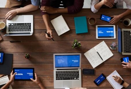 Project Management - Top View Photo Of People Near Wooden Table