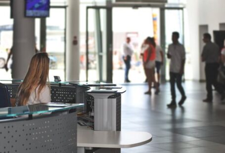Building Management - White Sitting Behind Counter Under Television
